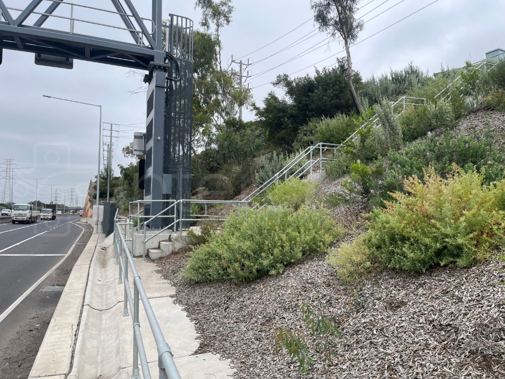 key clamp barrier installed next to a highway allowing maintenance staff safe to work safely